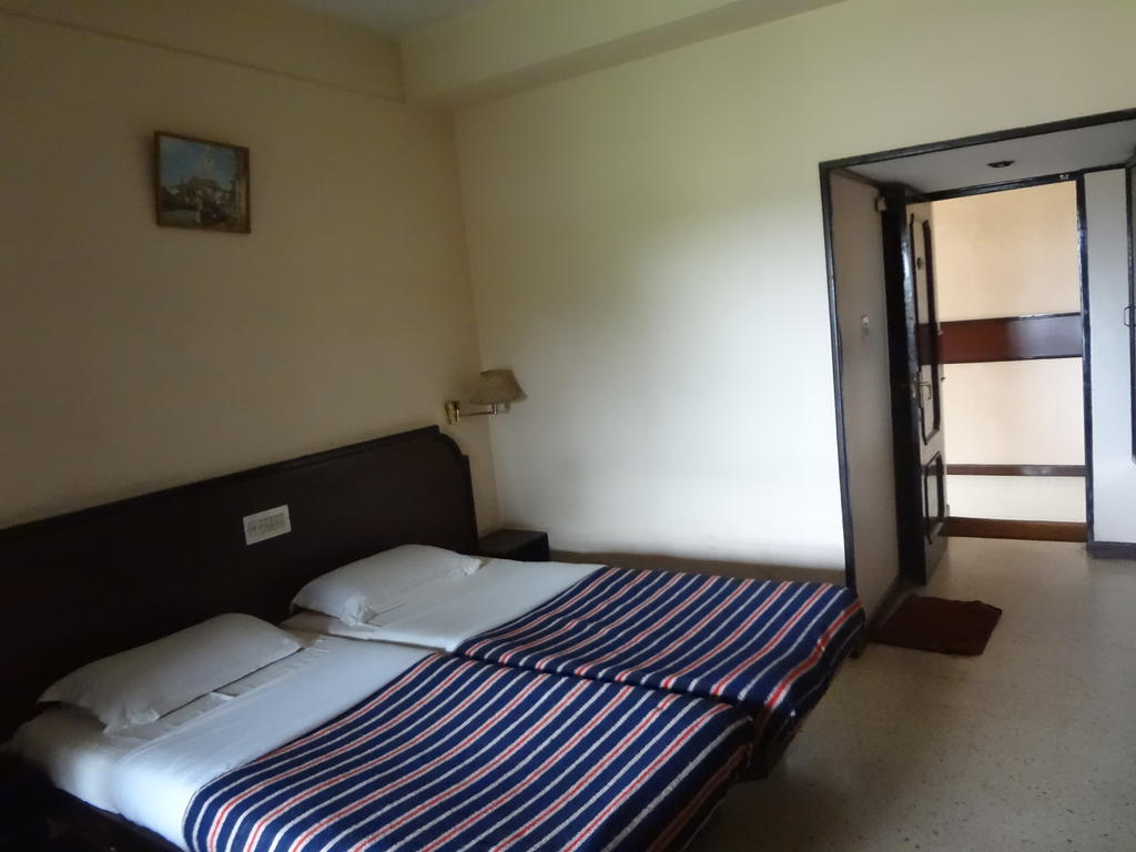 Hotel New Rajdarshan Мадікері Номер фото